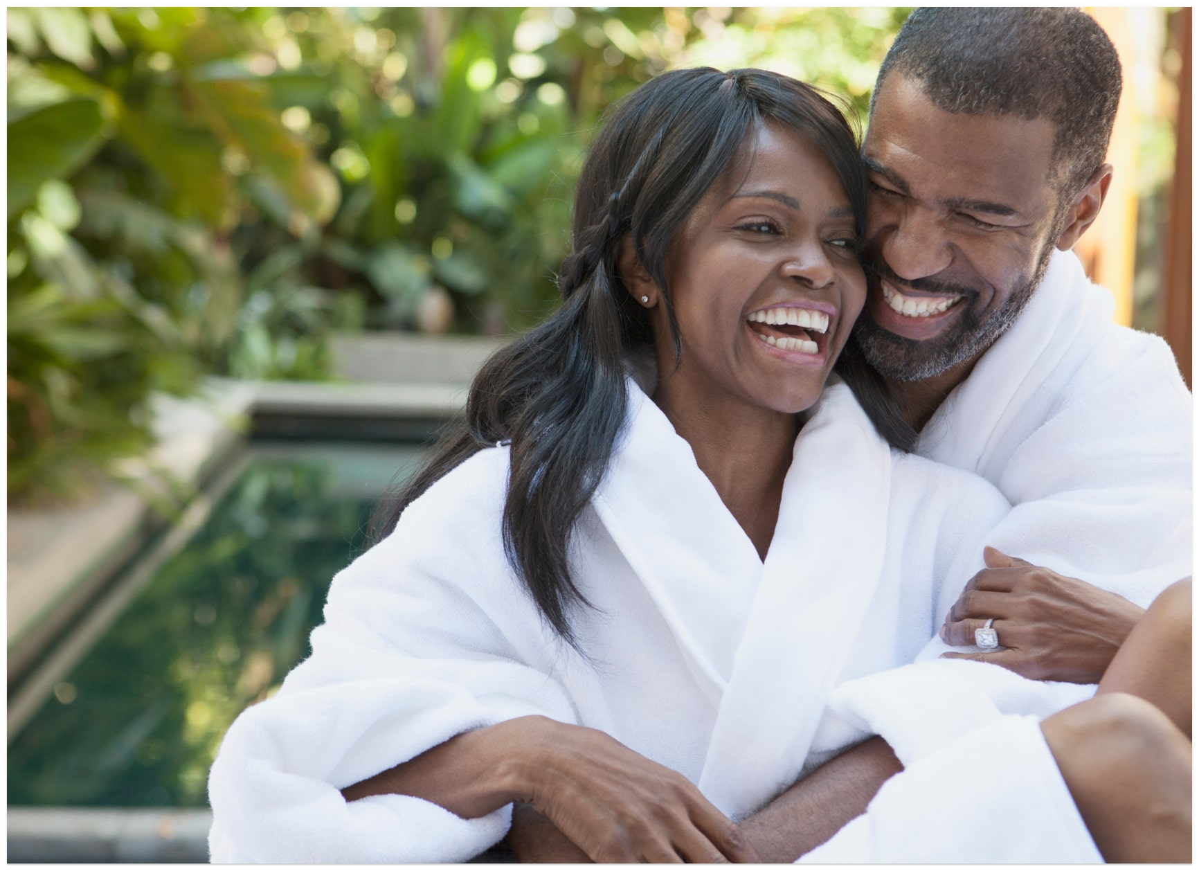 A man and a woman smiling and laughing